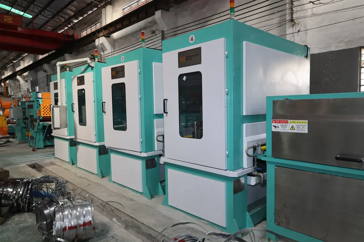 Enclosed polishing heads on a stainless steel coil-to-coil No.4 finishing line